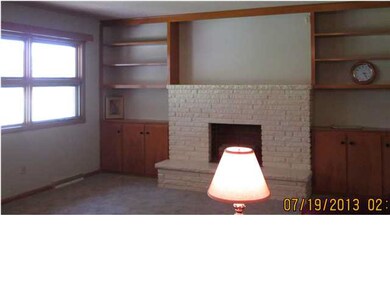 The family room has brand new carpet, a fireplace 