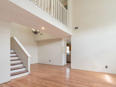 The open family room space has the dining room to the back and family room to the front.  The high ceilings are all the way to the 2nd story.