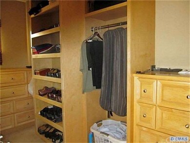 Large Walk-in Closet with built-ins