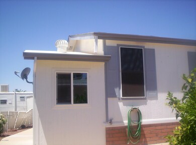 Stick built attached storage shed