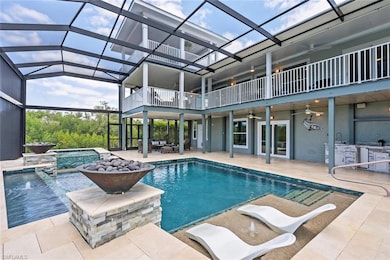 Pool with an outdoor hot tub, a ceiling fan, exter