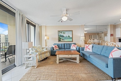 Living area with ceiling fan, crown molding, a textured ceiling, and light tile patterned floors