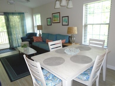 Dining area featuring ceiling fan and hardwood / w