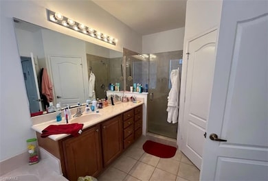 Bathroom with vanity, tile patterned flooring, and