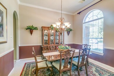 Great Formal Dining room complete with chair rail and crown molding.