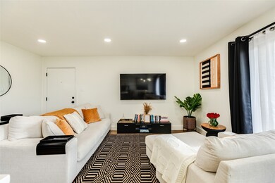 Living area with entrance to condo. Installed rece