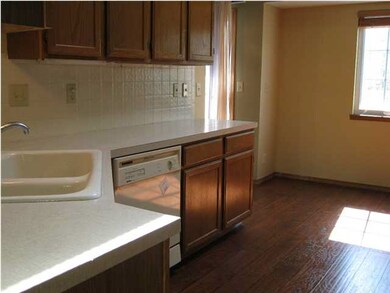 Eat in kitchen with wood floors