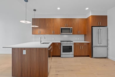 Kitchen featuring stainless steel appliances, a s