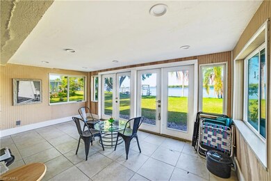 Sunroom featuring french doors and a healthy amoun