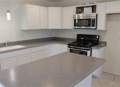 Large Island kitchen work space with storage and e