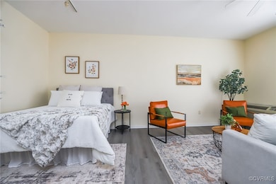 Bedroom featuring dark hardwood / wood-style floor