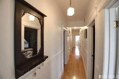 Two of the three flats have wood floors; one flat 