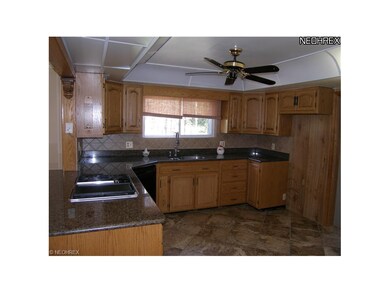 Unit 1 Kitchen view B. Granite counter top and gas