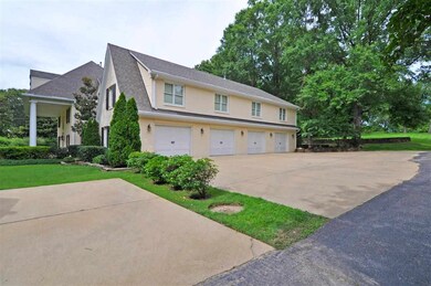 This home features a 4-car garage located to the s