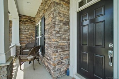 Upgraded stone accent and comfortable front porch.
