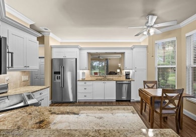 Kitchen with dark hardwood / wood-style flooring,