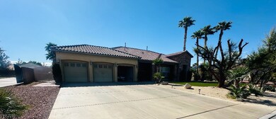 Mediterranean / spanish home featuring a garage, a