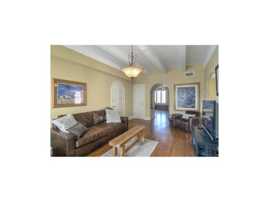 Another view of the living room showing front door