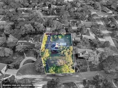Aerial view of property and surrounding area with property boundaries highlighted