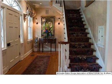 THE FOYER FEATURING THE FRONT STAIRS