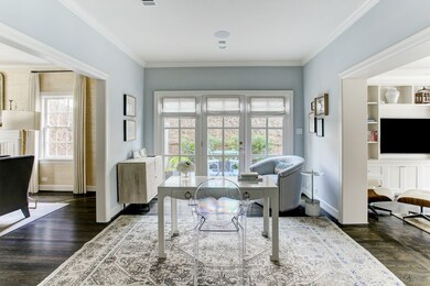 Thoughtfully positioned between the formal living room and the family room lies the study. Beautiful wall of windows provide access to the side patio and flood the space with an abundance of natural light. Notice how the massive cased openings allow for a seamless flow from room to room.