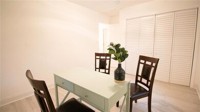 Dining area with light wood-type flooring