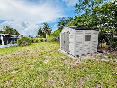 View of shed with a sunroom