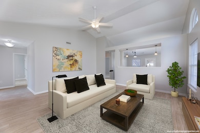 GREAT ROOM: Large Great Room features all new paint, new LVP Flooring, new Blinds and Ceiling Fan.  Open Concept Floorplan with the Great Room overlooking the Kitchen.