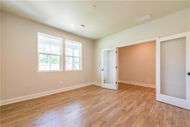 Unfurnished bedroom with light hardwood / wood-sty