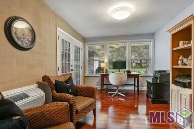 French doors separate the office from the family r