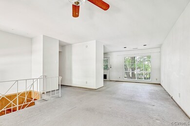 upstairs living room area w ceiling fan
