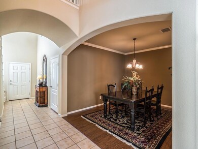 Tiled entry is bright with natural light & leads y