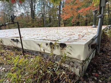 NEWER RUBBER ROOF COVERED WITH TARP AS EXTRA PROTE