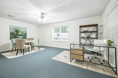 First-floor secondary bedroom with concrete floors