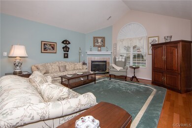 Living area has a gas fireplace with tile surround