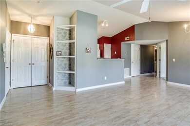 Inviting entry with built in shelving to show off your most prized possessions. Also note the closet space behind double doors.