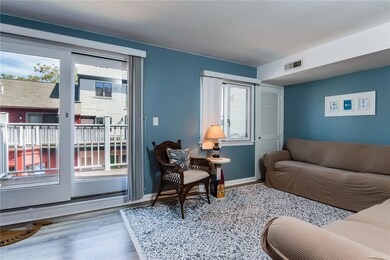 Living room , doors to deck