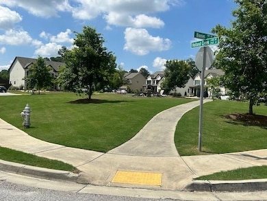 View of home's community with a residential view and a lawn
