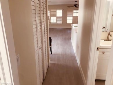 Hall featuring baseboards and light wood-type flooring