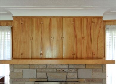 Living room wood paneling has an interesting inter