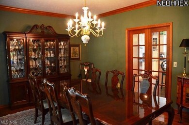 French doors lead to the kitchen