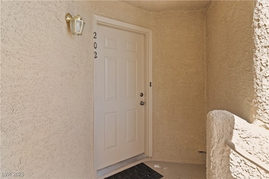 Doorway to property with stucco siding
