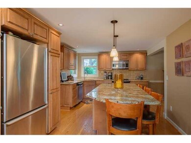 Kitchen. Stainless steel refrigerator, granite isl