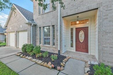 Covered front entry with a beveled glass Texas star front door.