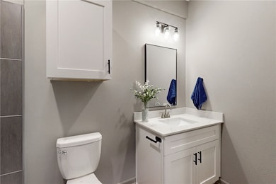 Bathroom with vanity and toilet