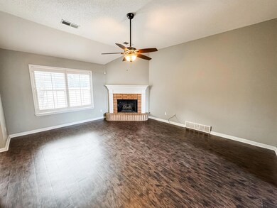 Unfurnished living room featuring lofted ceiling, 