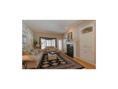 Closer view of the living room with cozy gas log f