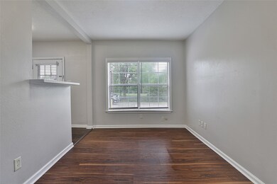 Dining room with breakfast bar and large window for more natural light.