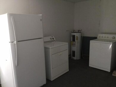 Utility room added at the back of the home.  Some water damage in this room.  All appliances shown remain with the house.