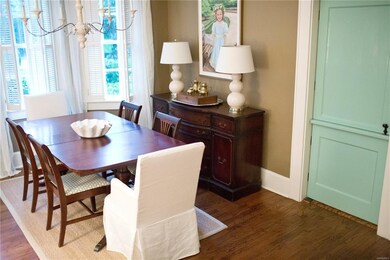 Beautiful dutch door that separates dining room fr